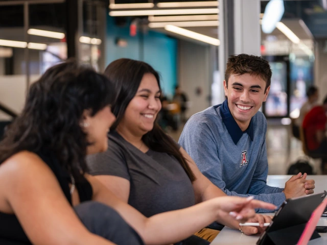Group of 3 students sitting together and talking