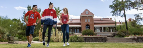group of students walking on a college campus